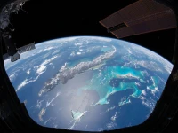 The space station seen with the curve of Earth in the distance